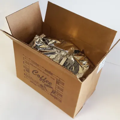 An open cardboard case filled with foil-sealed bags of coffee